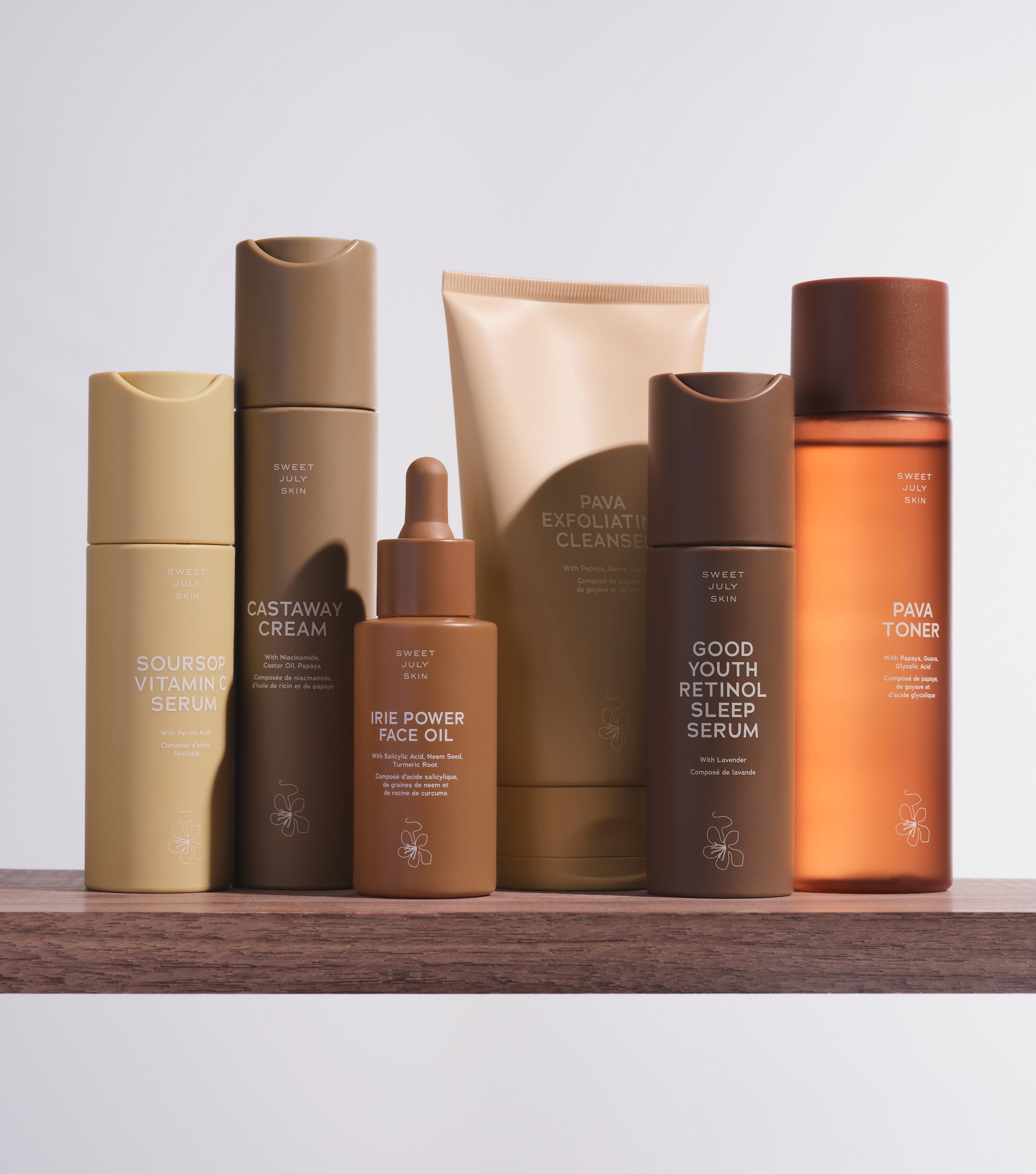 Sweet July skincare collection featuring Pava Cleanser, Pava Toner, Soursop Vitamin C Serum, Good Youth Retinol Serum, Castaway Cream, and Irie Power Face Oil