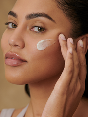 Ayesha Curry applying Pava Exfoliating Cleanser