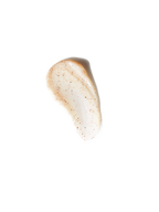 Beige cleansing scrub with brown granules.

