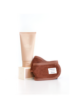 Skincare cleanser set by Sweet July Skin, including a cleanser tube and brown microfiber makeup remover pads.
