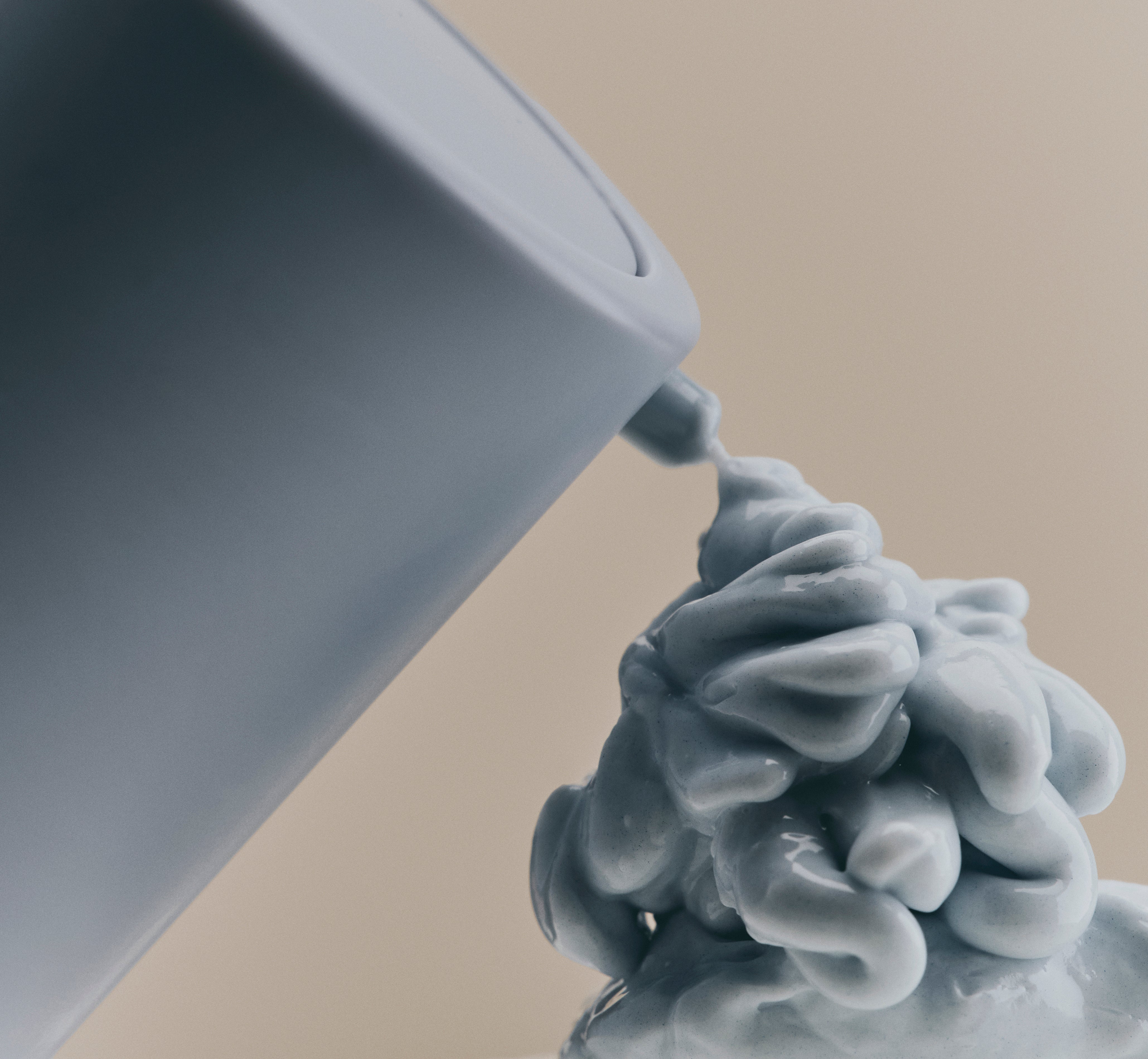 Sweet July Skin Coffee Fix Peptide Eye Cream dispensing to show the rich, creamy texture and light blue formula color