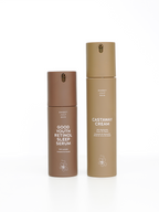 Two brown skincare bottles by Sweet July Skin on a white background.