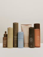 Set of skincare products by Sweet July Skin in various sized containers.