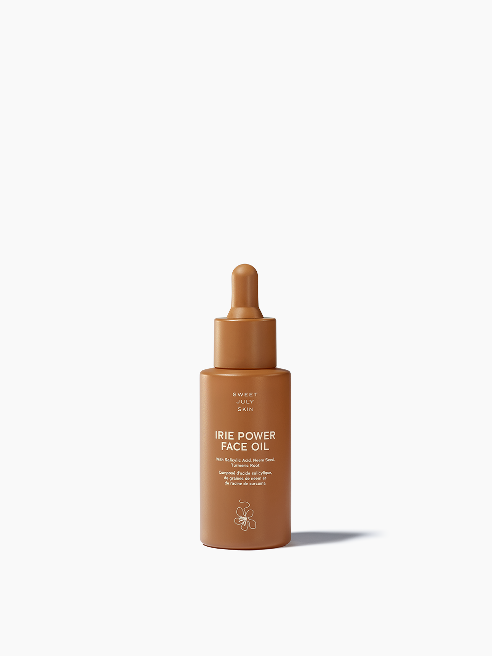 Brown glass bottle of face oil by Sweet July Skin with a dropper top.
