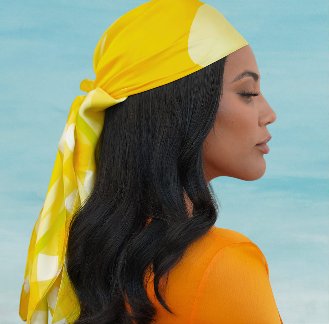 Founder Ayesha Curry wears gift with purchase Summer Scarf